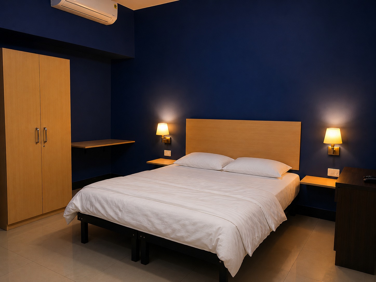 Premium room with a wardrobe and desk against a navy wall