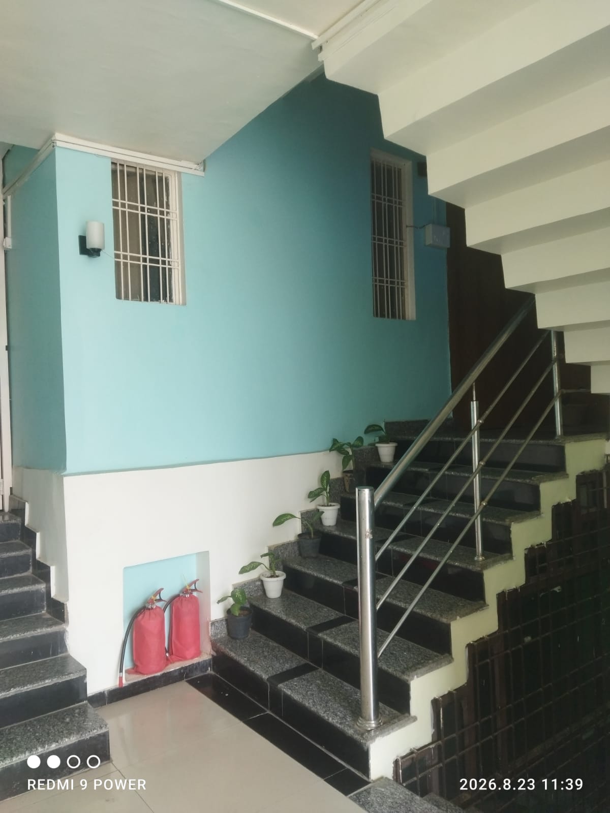 Stairwell with fire extinguishers kept in a recess